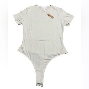 SKIMS Stretchy Cotton Jersey T-Shirt Bodysuit in Soot